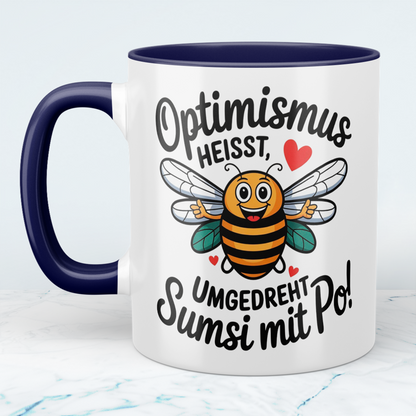Lustige Tasse mit Spruch: Optimismus heißt umgedreht Sumsi mit Po! - Perfektes Geschenk fürs Büro!