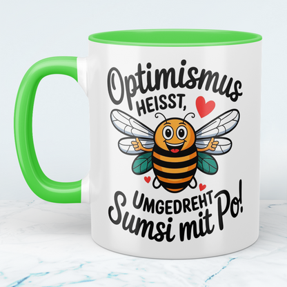 Lustige Tasse mit Spruch: Optimismus heißt umgedreht Sumsi mit Po! - Perfektes Geschenk fürs Büro!