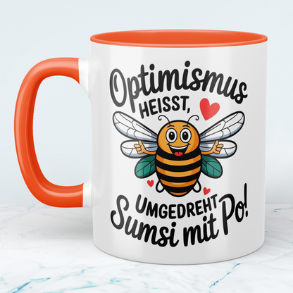 Lustige Tasse mit Spruch: Optimismus heißt umgedreht Sumsi mit Po! - Perfektes Geschenk fürs Büro!